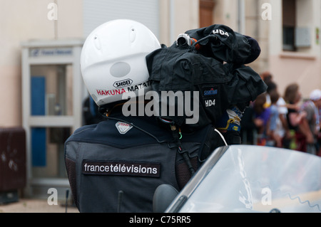 An outside broadcast cameraman for France Televisions filming the Tour de France. Stock Photo