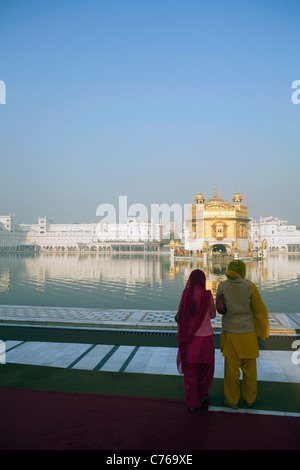 Two women at the Golden Temple in Amritsar, India. Stock Photo