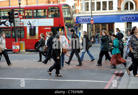 Commuters on way home from work  outside Victoria railway station London 2011 Stock Photo