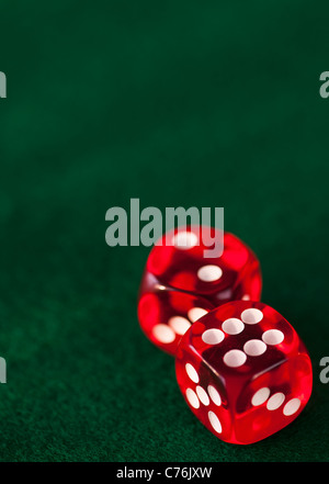 Close up of red dices on green felt Stock Photo