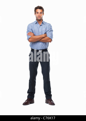 Studio shot of confident business man standing with hands folded Stock Photo
