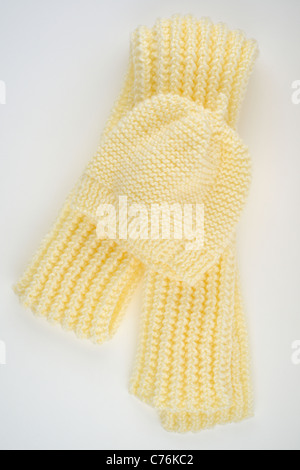 Hand Knitted cream coloured ribbed folded scarf and close fitting beanie hat Stock Photo