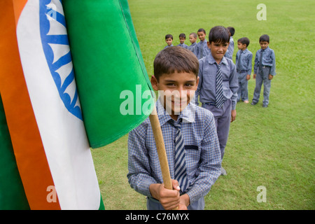 Portrait of a school boy holding the Indian flag Stock Photo