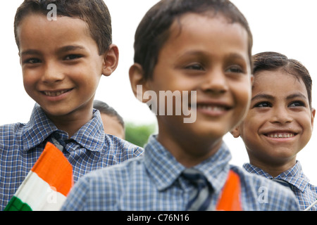 Portrait of a school boy holding the Indian flag Stock Photo