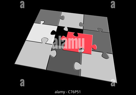 jigsaw puzzle parts: one red part apart Stock Photo