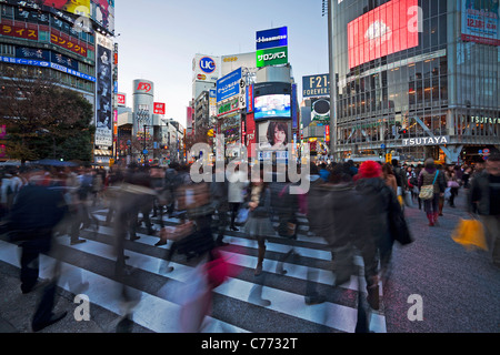 Asia, Japan, Tokyo, Shibuya, Shibuya Crossing - crowds of people crossing the famous intersection at the centre of Shibuya Stock Photo