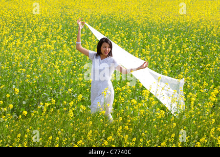 Woman enjoying herself in a field Stock Photo