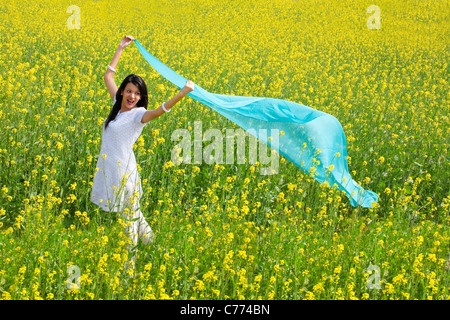 Woman enjoying herself in a field Stock Photo