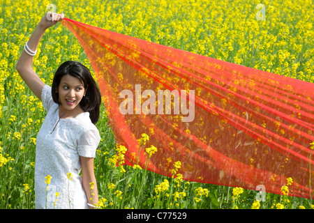 Woman with a chunni in a field Stock Photo