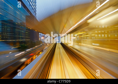 Asia, Japan, Honshu, Tokyo, POV blurred motion of Tokyo buildings from a moving train Stock Photo
