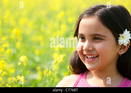 Young girl with a flower in her hair Stock Photo