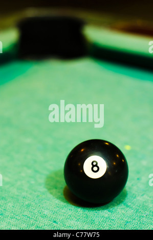 a close up of billiard ball number 8, solid black, for conceptual usage. Stock Photo