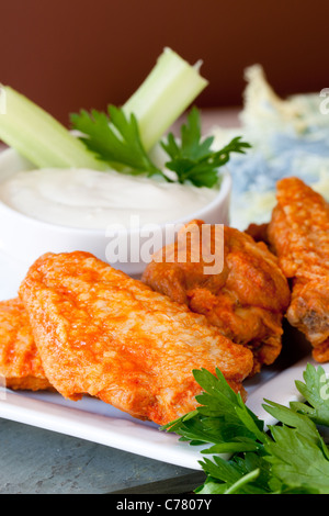 Hot and Spicy Buffalo Wings with Blue Cheese Dipping Sauce Stock Photo