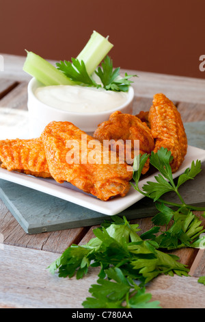 Hot and Spicy Buffalo Wings with Blue Cheese Dipping Sauce Stock Photo