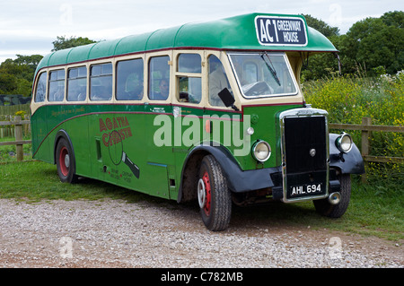 Vintage or classic bus conveying visitors from Churston park and ride to the National Trust property at Greenway, Devon, England Stock Photo