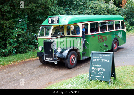 Vintage or classic bus conveying visitors from Churston park and ride to the National Trust property at Greenway, Devon, England Stock Photo