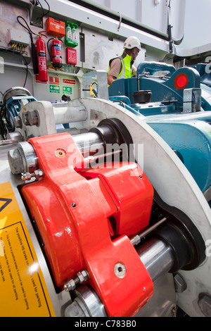 engineers working in the nacelle of a wind turbine in the Walney offshore wind farm. Stock Photo
