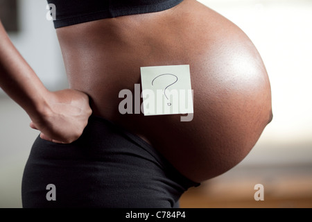 Profile of pregnant young woman's abdomen Stock Photo