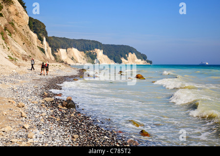 Walkers on beach by Chalk Cliffs, Jasmund National Park, Ruegen, Mecklenburg Vorpommern, Germany Stock Photo