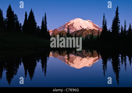 Mount Rainier and reflection in Upper Tipsoo Lake at sunrise; Mount Rainier National Park, Washington. Stock Photo