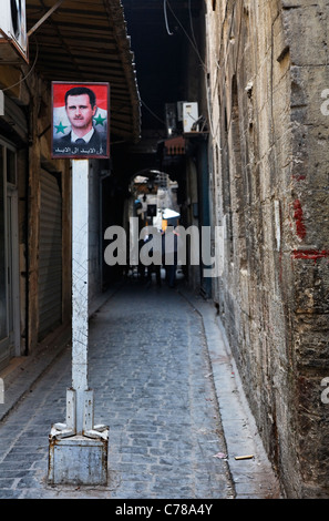 Alley with a picture of the Syrian president, Aleppo, Syria Stock Photo