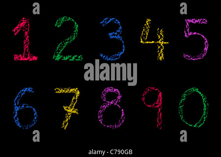 Handwritten numbers written on a blackboard in chalk Stock Photo