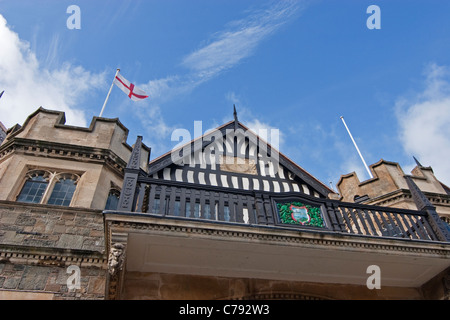 Looking up at Lynton Town Hall with blue skies above Stock Photo