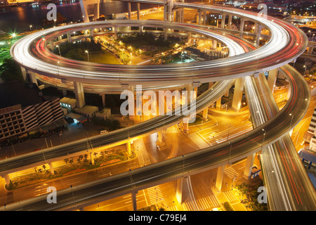 Traffic on roundabout leading to Nanpu bridge at dusk; Dongjiadu: Shanghai; China Stock Photo