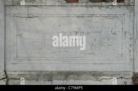 gray cracked plastered damaged wall for background texture Stock Photo