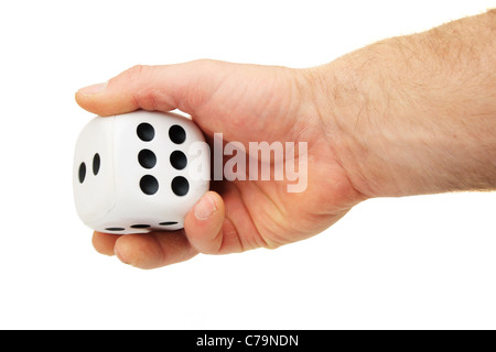a man's hand rolling a giant white die isolated on white Stock Photo