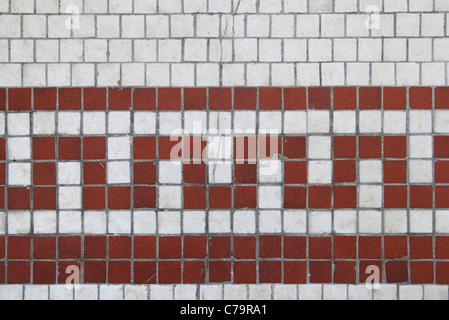 old cracked red tiled design on white tile background Stock Photo