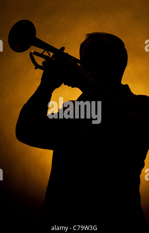 Trumpet Player Silhouette Yellow Stock Photo