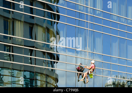 Window cleaner on the climbing rope, Santa Cruz, Tenerife, Canary Islands, Spain, Europe Stock Photo