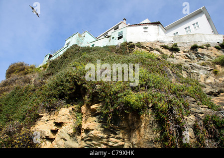 residential buildings over the cliff - Malpica de Bergantiños - Death coast - Galicia, Spain Stock Photo