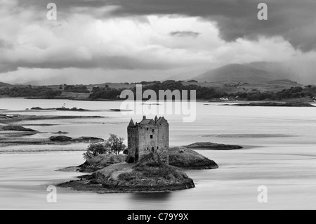 Brooding Storm Clouds Over Castle Stalker at Dusk on Loch Linnhe - Near Appin, Scotland Stock Photo