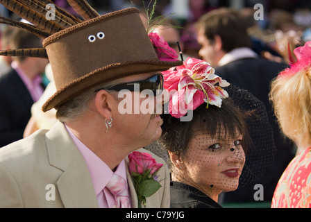 Man and Woman in Fancy Hats at Churchill Downs on Oaks Day in Louisville, Kentucky Stock Photo