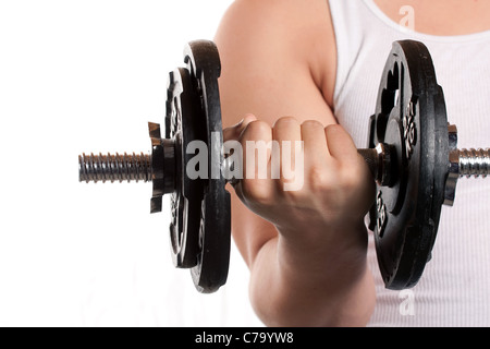 A young man lifting a dumbbell isolated over a white background. Stock Photo