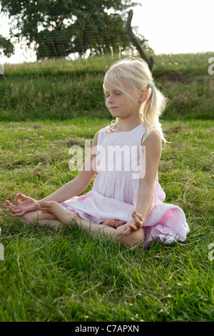 Portrait of a girl practicing yoga in summer, Eyendorf, Lower Saxony, Germany, Europe Stock Photo