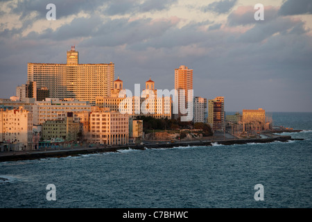 Buildings, Hotel Nacional in the center and Malecon sea drive at sunrise, City of Havana, Havana, Cuba Stock Photo