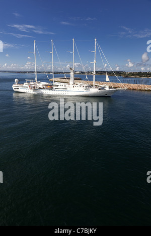 Wind Spirit a four-masted schooner of the Windstar Cruise Line arriving at Roscoff in the Bretagne region of France. Stock Photo