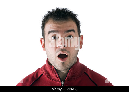 A shocked or surprised young man isolated over white. Stock Photo