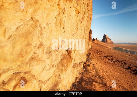 Shiprock Rock and face of dike ridge at sunrise, New Mexico, USA Stock Photo