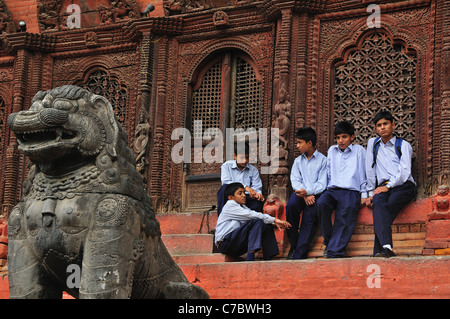 School boys at Shiva Parvati temple in Durbar Square, Stock Photo