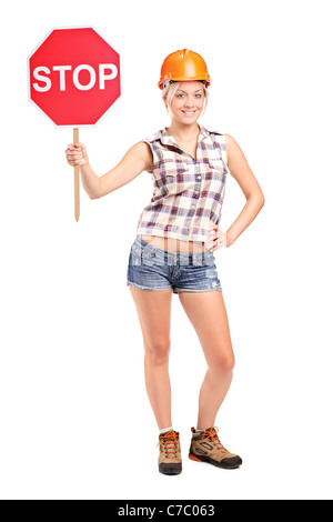 A construction worker holding a traffic sign stop Stock Photo - Alamy