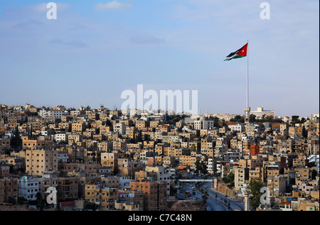 Large Jordanian flag flying over the city of Amman, Jordan Stock Photo