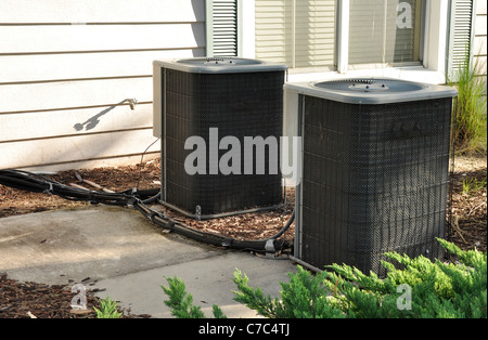 Two central out air conditioning units Stock Photo