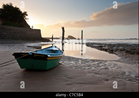 The sun setting on the Atlantic Coast at Bude in Cornwall Stock Photo