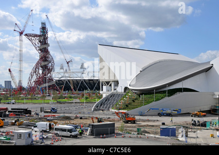 2012 Olympics Arcelor Mittal Orbit tower in London Olympic park with Aquatics Centre and part of main stadium Stratford Newham East London England UK Stock Photo