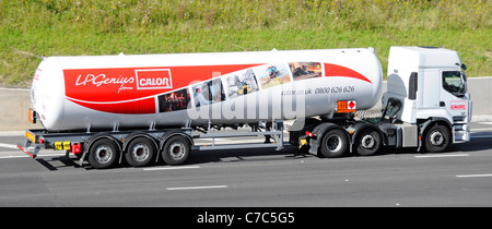 Calor Gas tanker trailer delivery lorry truck with Hazchem Hazardous Chemicals and Dangerous Goods warning sign England on UK motorway Stock Photo