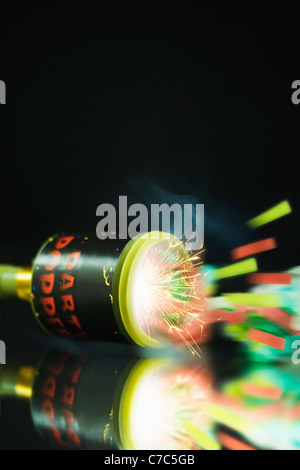 Close up shot of a Party Popper popping with sparks and streamers shooting out Stock Photo